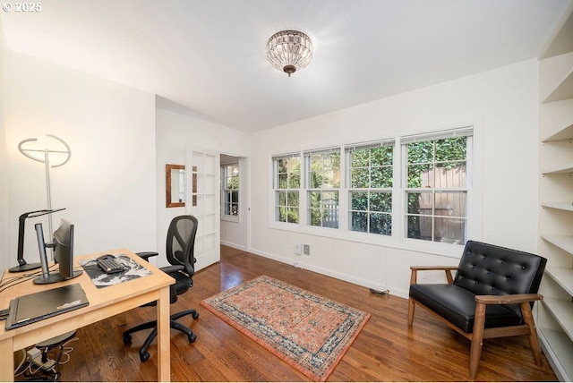 office with baseboards and wood finished floors