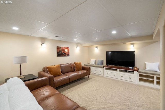 living area featuring recessed lighting, a paneled ceiling, visible vents, and light carpet