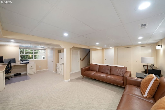 living area with stairs, light carpet, baseboards, a paneled ceiling, and recessed lighting