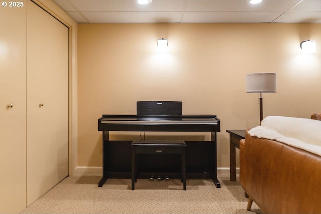 interior space featuring recessed lighting, a closet, a drop ceiling, and baseboards