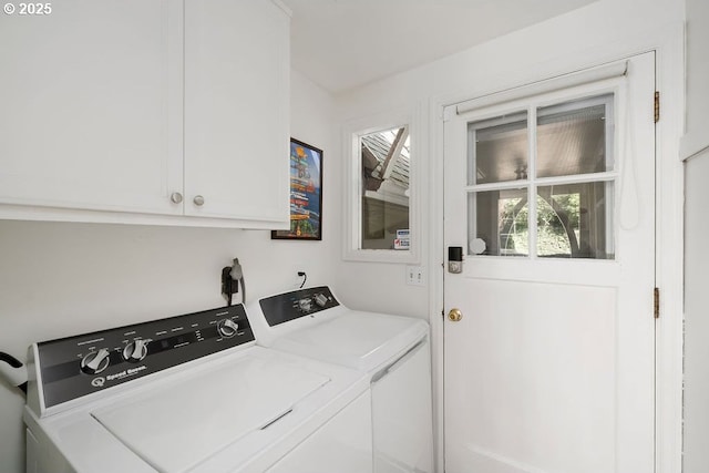 laundry room with washing machine and dryer and cabinet space