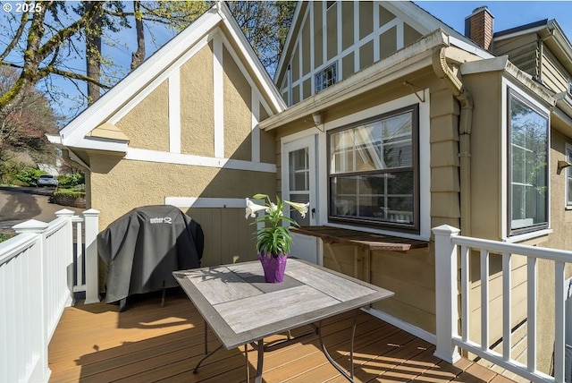 wooden deck featuring area for grilling
