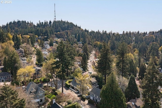 birds eye view of property featuring a residential view and a view of trees