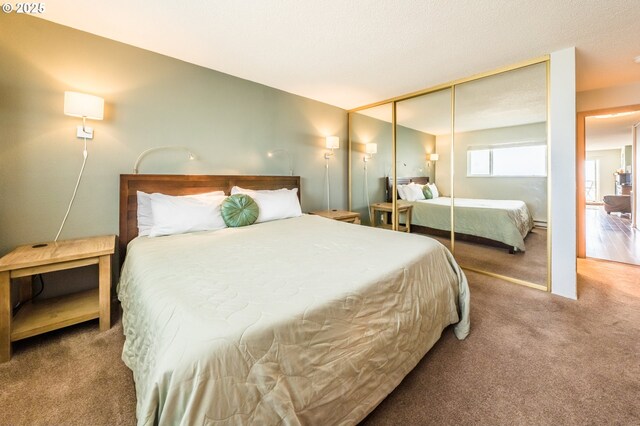 carpeted bedroom with a closet