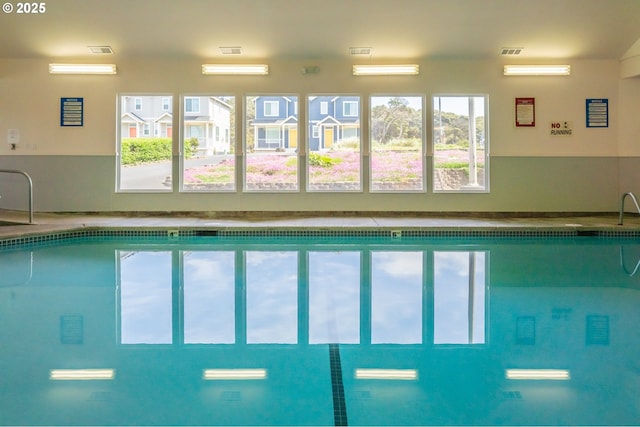 view of swimming pool with a sink