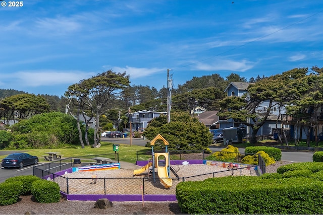 view of property's community with fence