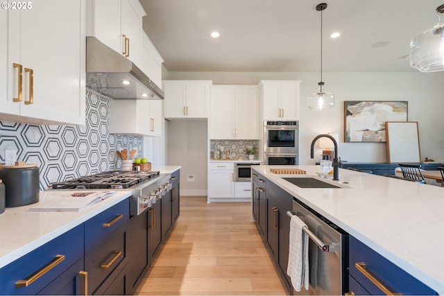 15174 SW 164th Ave Unit L12, Tigard, OR 97224 - kitchen featuring extractor fan, a sink, appliances with stainless steel finishes, white cabinetry, and recessed lighting