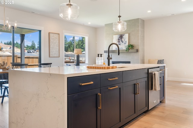 15174 SW 164th Ave Unit L12, Tigard, OR 97224 - kitchen with stainless steel dishwasher, light wood-type flooring, pendant lighting, recessed lighting, and a kitchen island