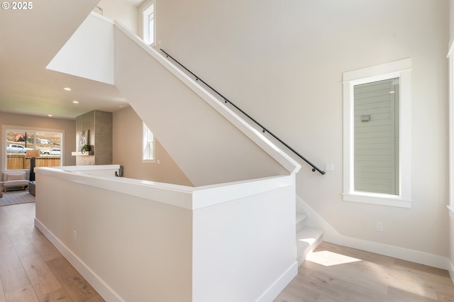 15174 SW 164th Ave Unit L12, Tigard, OR 97224 - staircase featuring plenty of natural light, a towering ceiling, hardwood / wood-style flooring, recessed lighting, and baseboards
