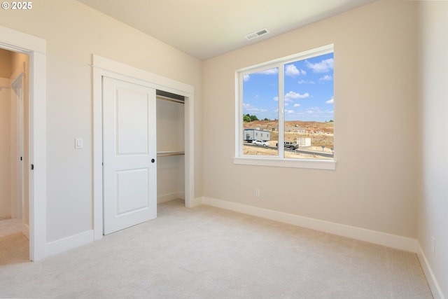 15174 SW 164th Ave Unit L12, Tigard, OR 97224 - unfurnished bedroom with carpet floors, baseboards, and a closet