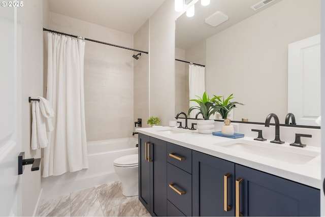 15174 SW 164th Ave Unit L12, Tigard, OR 97224 - bathroom with double vanity, shower / bath combo, toilet, and marble finish flooring