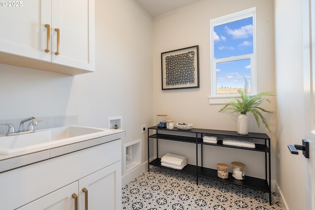 15174 SW 164th Ave Unit L12, Tigard, OR 97224 - washroom with electric dryer hookup, cabinet space, washer hookup, and baseboards