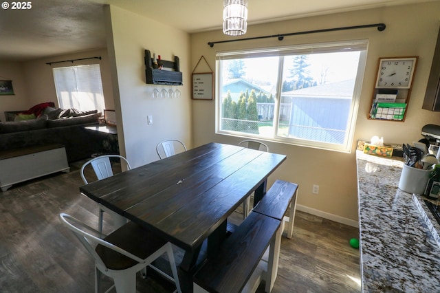 dining room with dark wood-type flooring