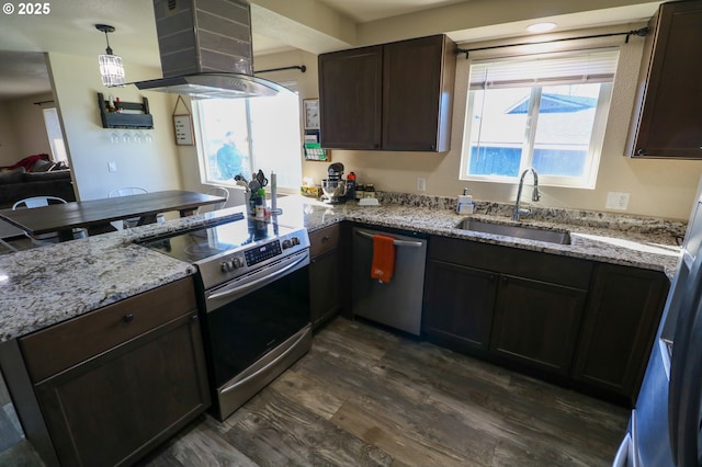 kitchen with dark hardwood / wood-style flooring, island exhaust hood, stainless steel appliances, sink, and hanging light fixtures