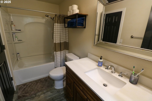 full bathroom featuring toilet, wood-type flooring, vanity, and shower / bath combo with shower curtain