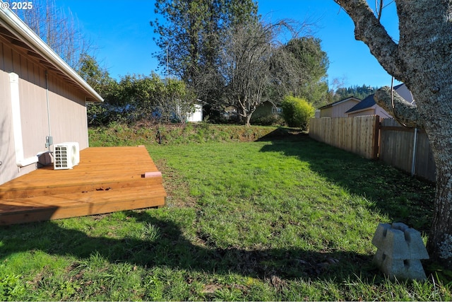 view of yard featuring ac unit and a wooden deck