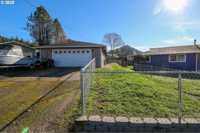 view of front of property with a front yard and a garage