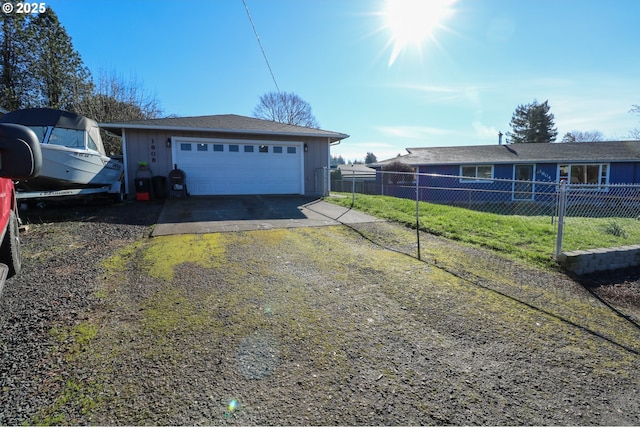 view of property exterior with a garage and an outbuilding