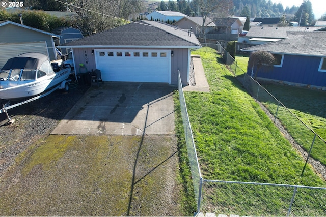 garage featuring a yard