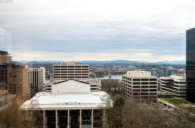 city view featuring a water and mountain view