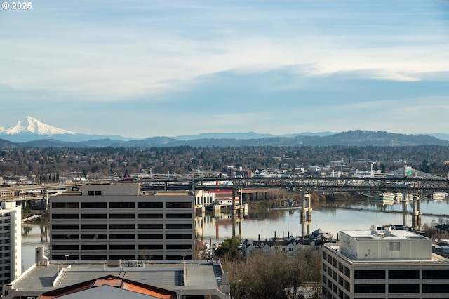 city view with a water and mountain view