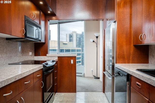 kitchen with a city view, light countertops, baseboard heating, backsplash, and black appliances