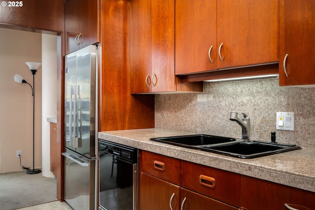 kitchen with black dishwasher, high quality fridge, backsplash, and a sink