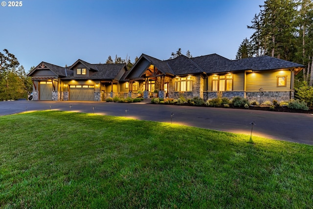 32568 Deberry Rd, Creswell, OR 97426 - view of front of home featuring stone siding, a front lawn, an attached garage, and driveway