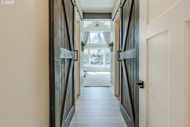 32568 Deberry Rd, Creswell, OR 97426 - hall with a barn door and light wood-type flooring