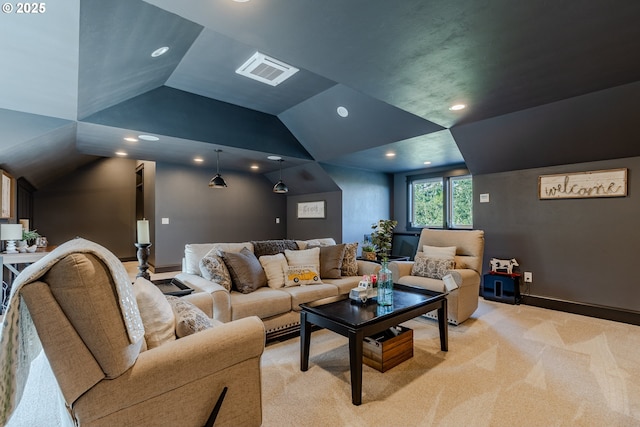 cinema featuring light colored carpet and vaulted ceiling