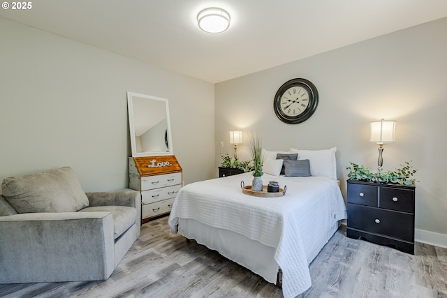 bedroom with light hardwood / wood-style flooring