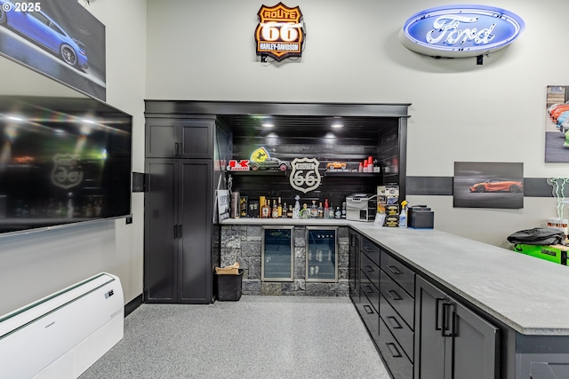 bar with wine cooler and a baseboard radiator