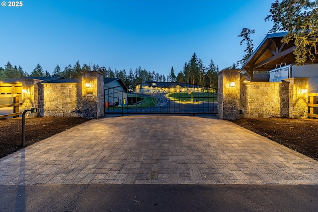 view of gate at dusk