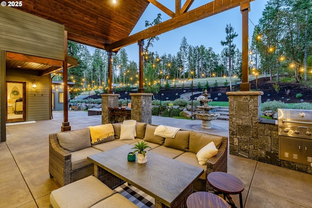 patio terrace at dusk with an outdoor living space and a grill