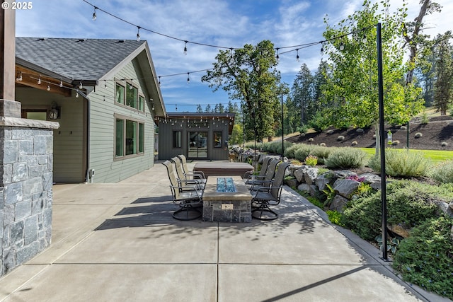 view of patio with an outdoor fire pit