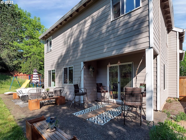 back of property with a patio