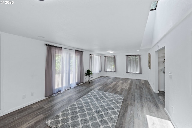 586 11th Ave, Coos Bay, OR 97420 - unfurnished living room featuring wood finished floors and baseboards