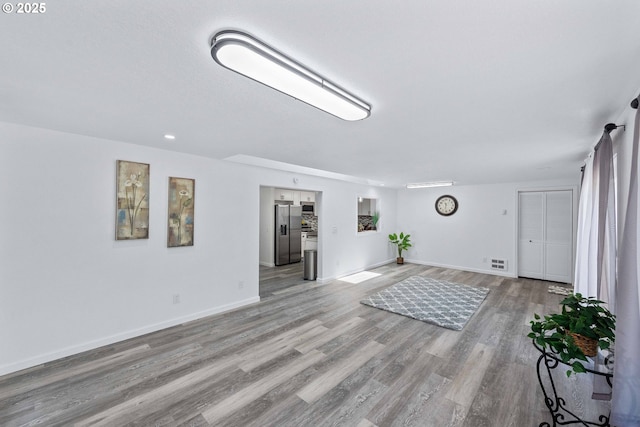 586 11th Ave, Coos Bay, OR 97420 - unfurnished living room featuring light wood-type flooring and baseboards