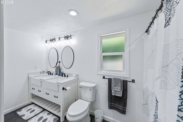 586 11th Ave, Coos Bay, OR 97420 - full bath with a textured ceiling, baseboards, vanity, and toilet