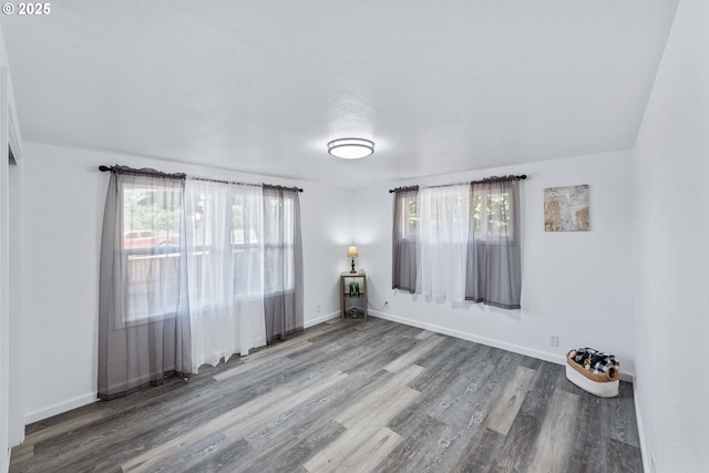 586 11th Ave, Coos Bay, OR 97420 - spare room with wood finished floors and baseboards
