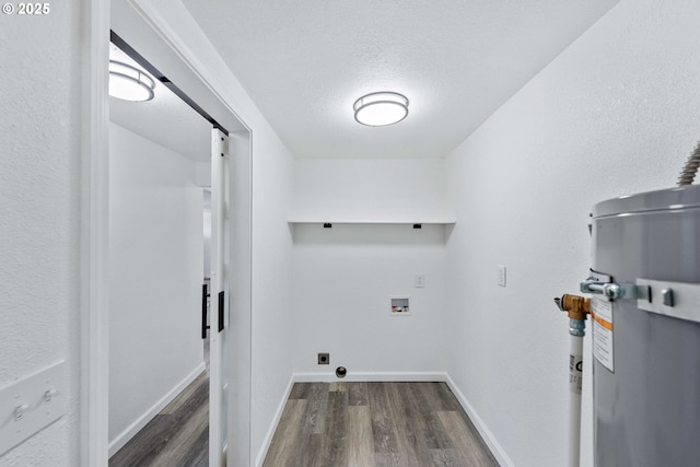 586 11th Ave, Coos Bay, OR 97420 - laundry room featuring wood finished floors, water heater, hookup for a washing machine, electric dryer hookup, and baseboards