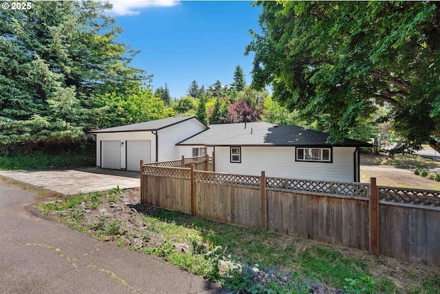 586 11th Ave, Coos Bay, OR 97420 - view of front of home featuring an attached garage and concrete driveway