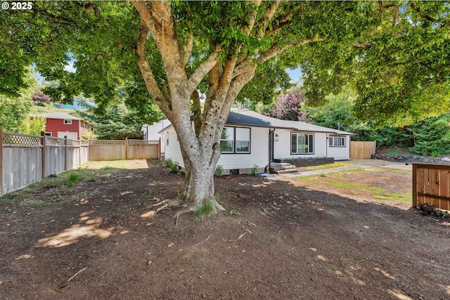 586 11th Ave, Coos Bay, OR 97420 - view of front of property with a fenced backyard and view of wooded area