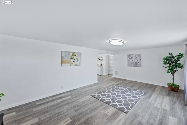 586 11th Ave, Coos Bay, OR 97420 - empty room with wood finished floors and baseboards