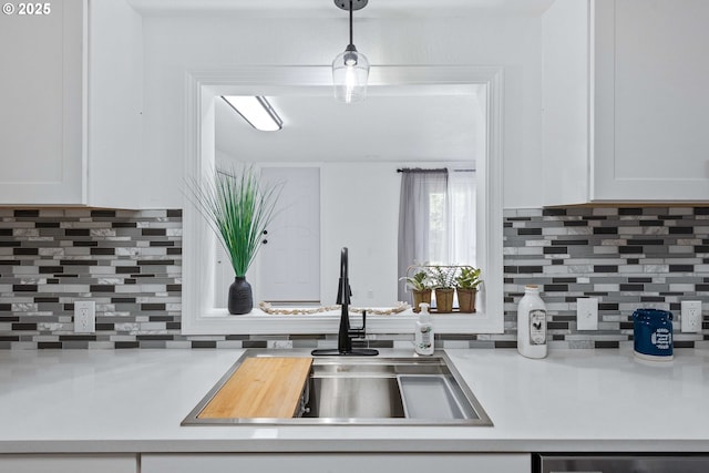 586 11th Ave, Coos Bay, OR 97420 - kitchen featuring a sink, tasteful backsplash, and white cabinetry