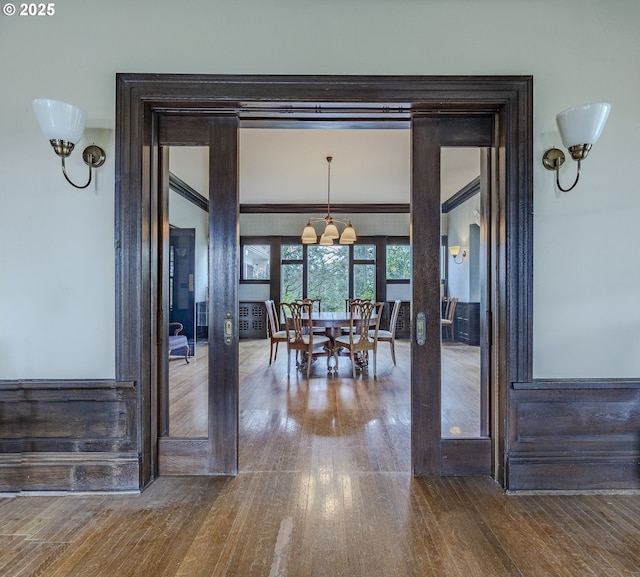 dining area featuring ornamental molding and hardwood / wood-style floors