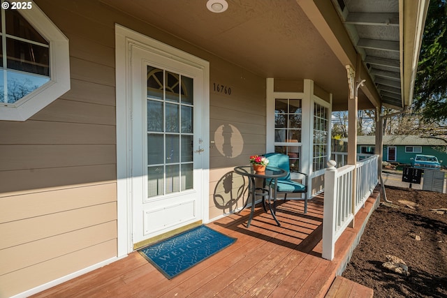 doorway to property with covered porch