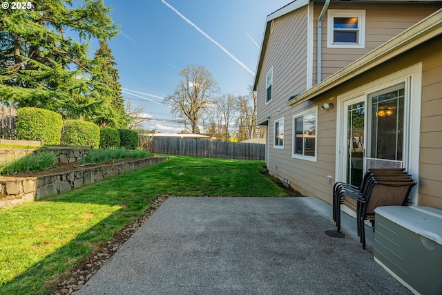 view of yard with a patio and fence