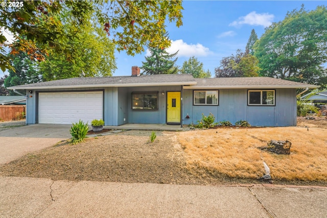 single story home with a porch and a garage