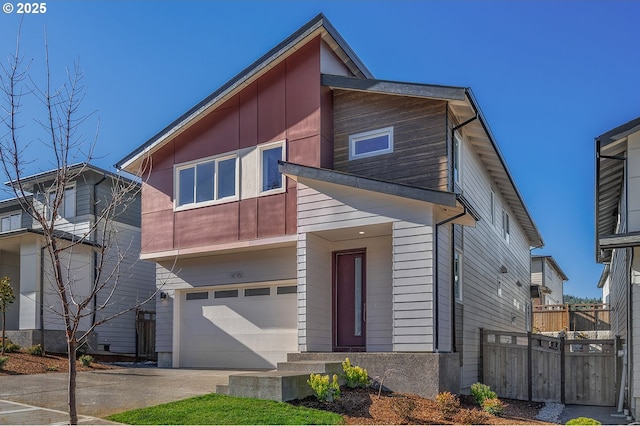 16755 SE Shimmering Leaf St, Happy Valley, OR 97086 - contemporary house with fence, driveway, and a garage